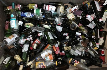 empty glass bottles in a pile